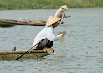 Fischer auf dem Fluss Thu Bon